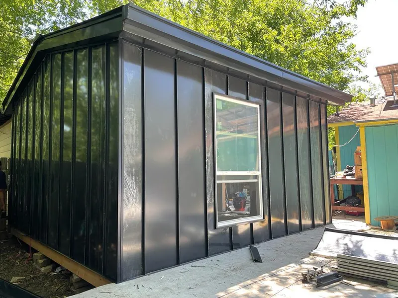 Black standing seam metal wall panels for Roof Inspection in New Hanover